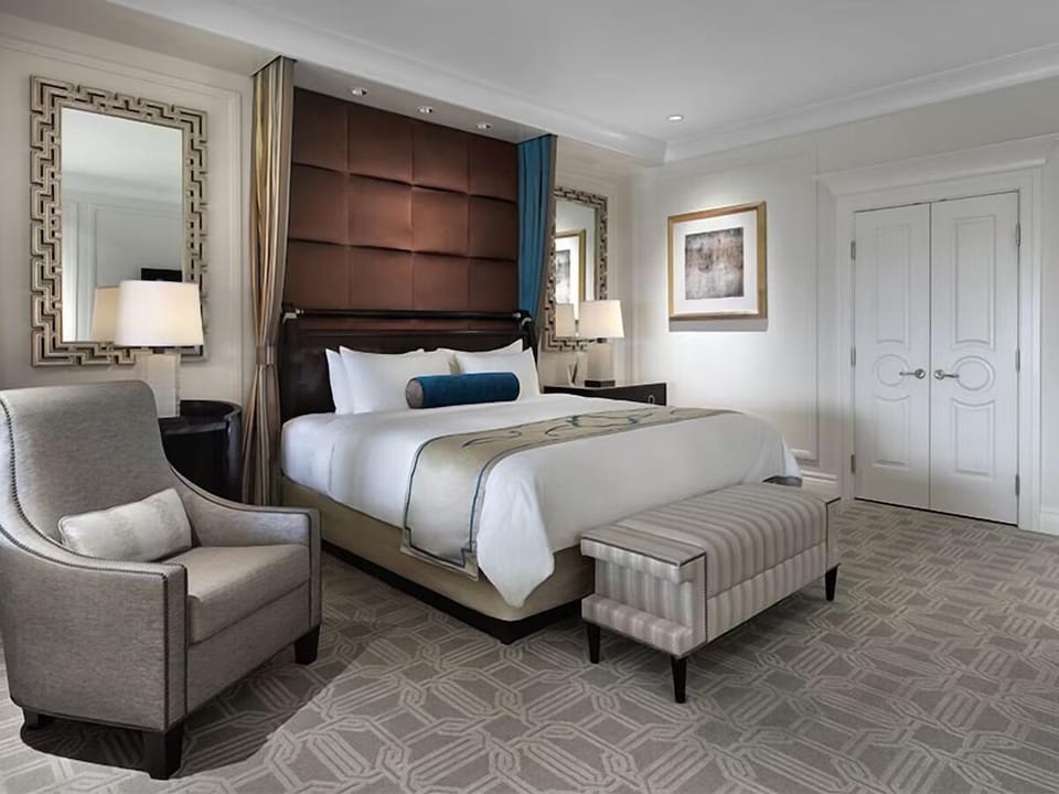 Sink into crisp pillows in a serene, designer-styled retreat.