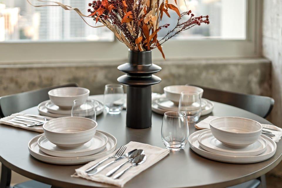 A beautifully set table ready for your stay, creating the perfect setting for shared meals, takeout nights, or a simple coffee with a view.