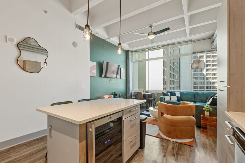 Living Area: Modern elegance meets urban charm with stunning views and vibrant decor!