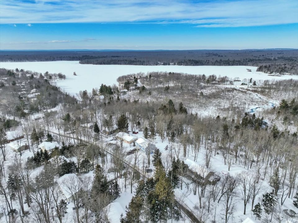 Winter serenity from above—your private Pocono escape tucked in the trees in proximity to the lake.