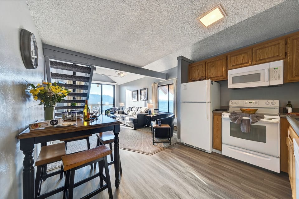View of the breakfast bar and dining table area.