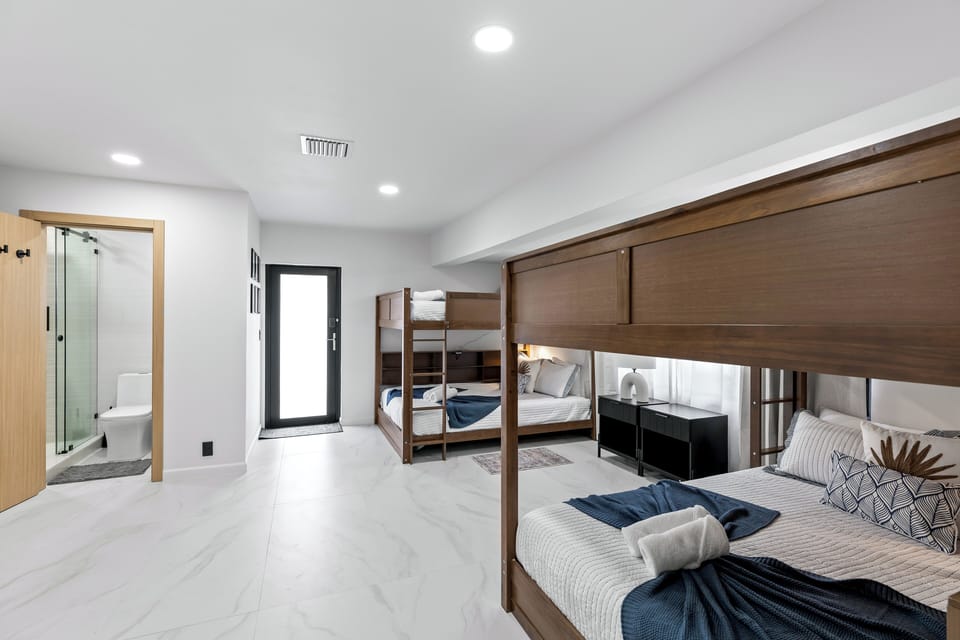 Bedroom 4 features 2 full-over-full bunk beds and an ensuite bathroom.