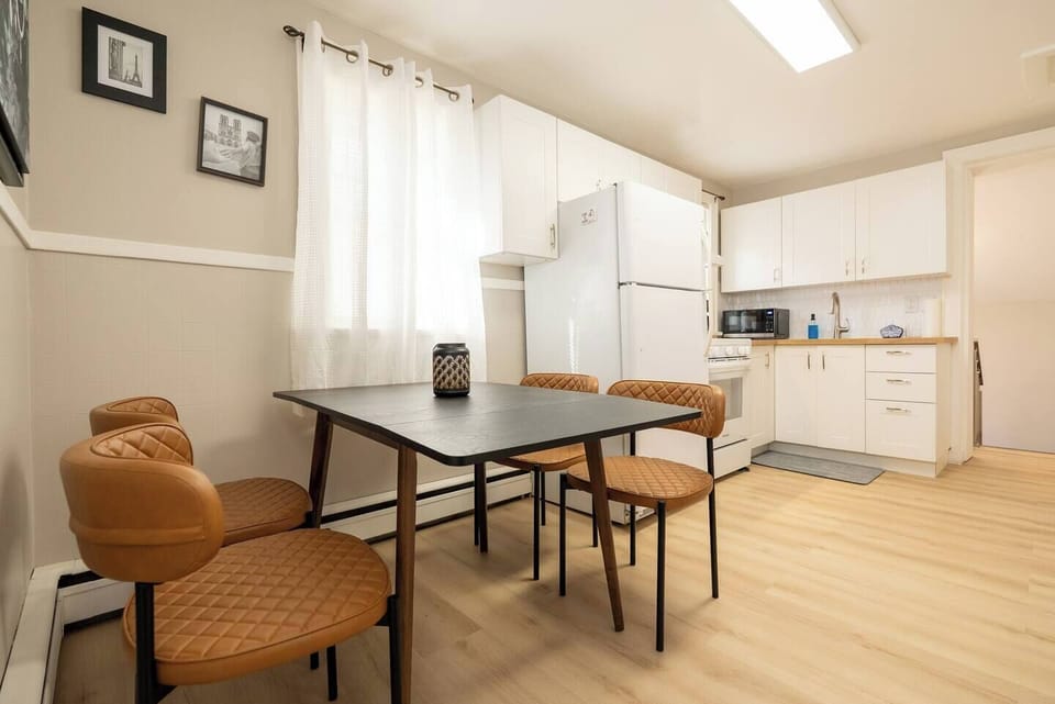 Cozy dining space perfect for meals, work, or planning your day in Sudbury.