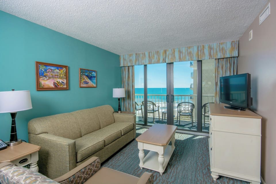 Unwind on the sofa with balcony views and sea air.