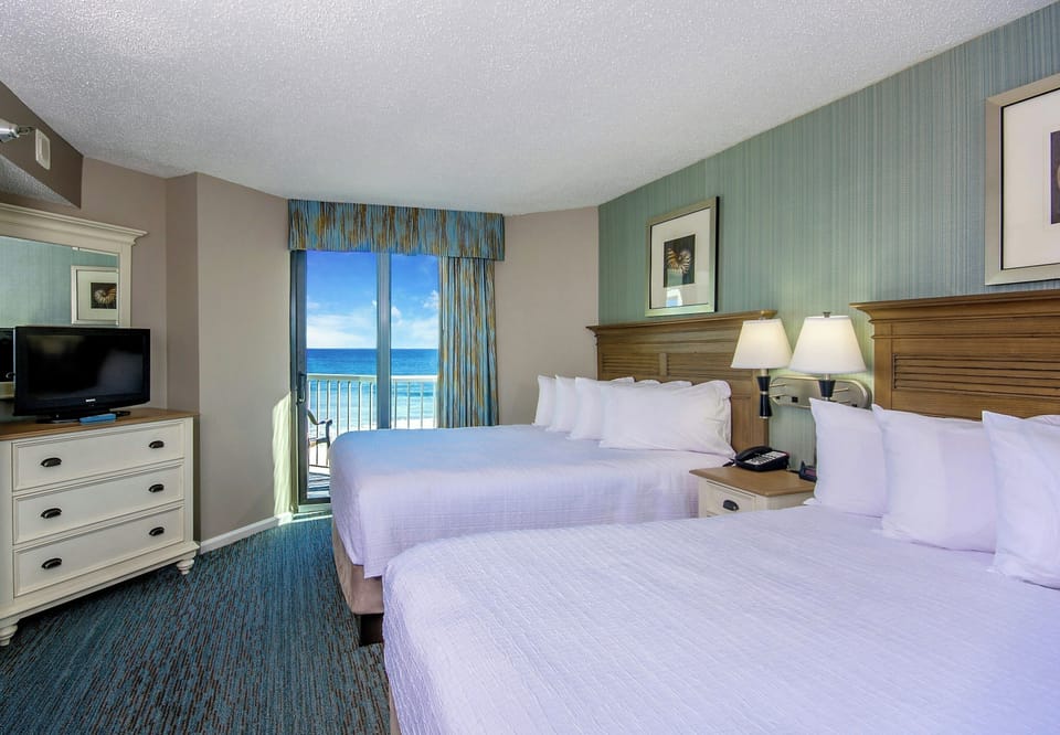 Settle into crisp beds and drift off to ocean breezes.