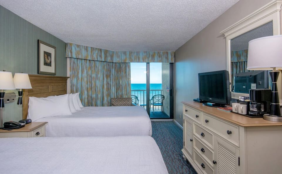 Wake up to ocean views from your private balcony retreat.