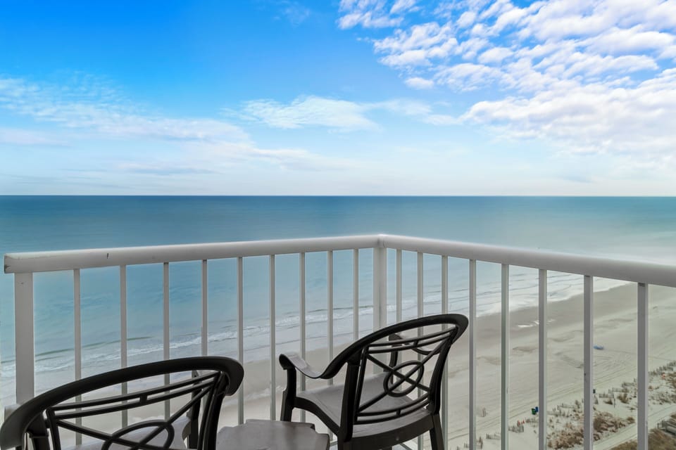 Sip morning coffee as endless ocean views soothe you.