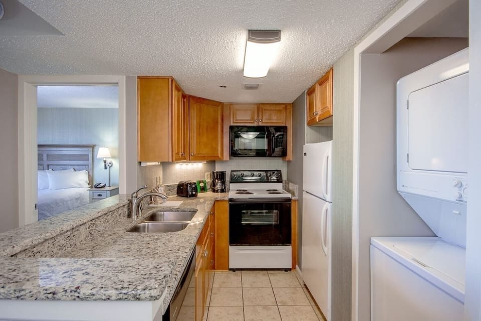 Cook vacation favorites with full kitchen appliances and granite counters.