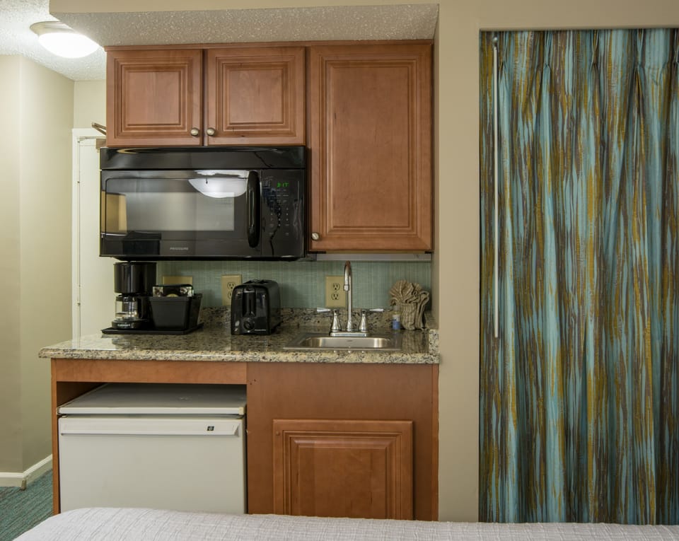 Brew fresh coffee anytime with convenient kitchenette essentials.