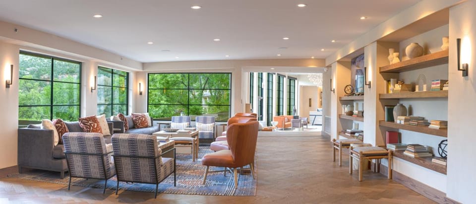 Unwind on plush seating with bright, airy mountain views.