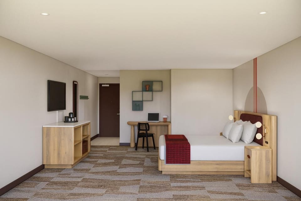 Unwind in a spacious king room with work desk and TV