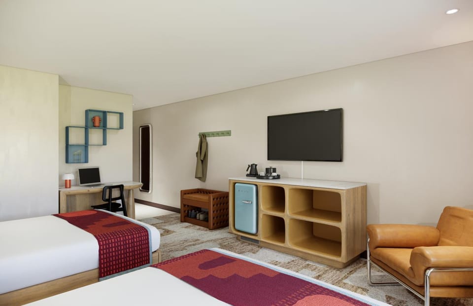 Kick back after adventures with lounge chair and in-room coffee setup