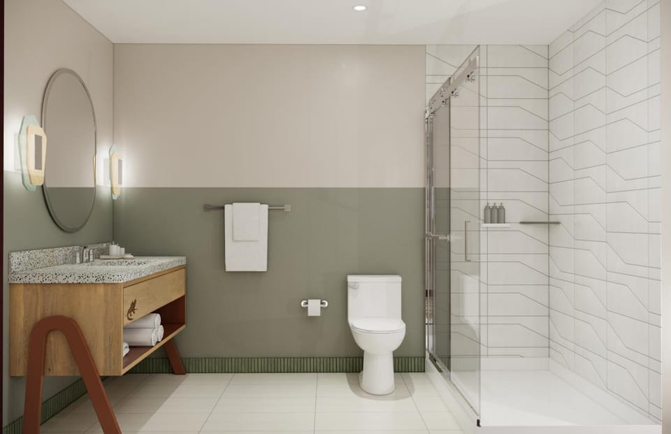 Refresh in a sparkling bath with walk-in shower and bright vanity