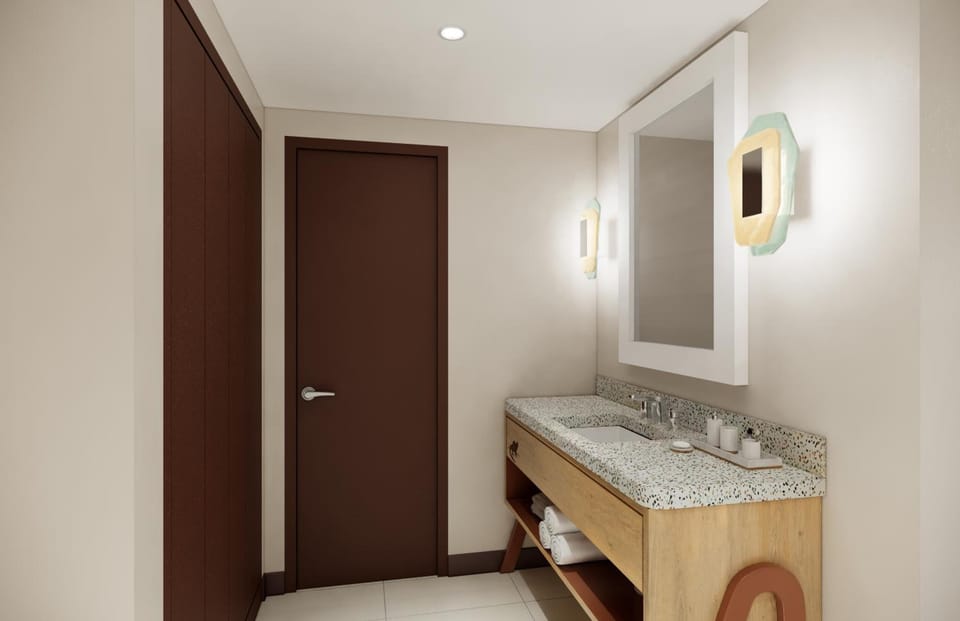 Start your day at the stylish vanity with warm, flattering light.