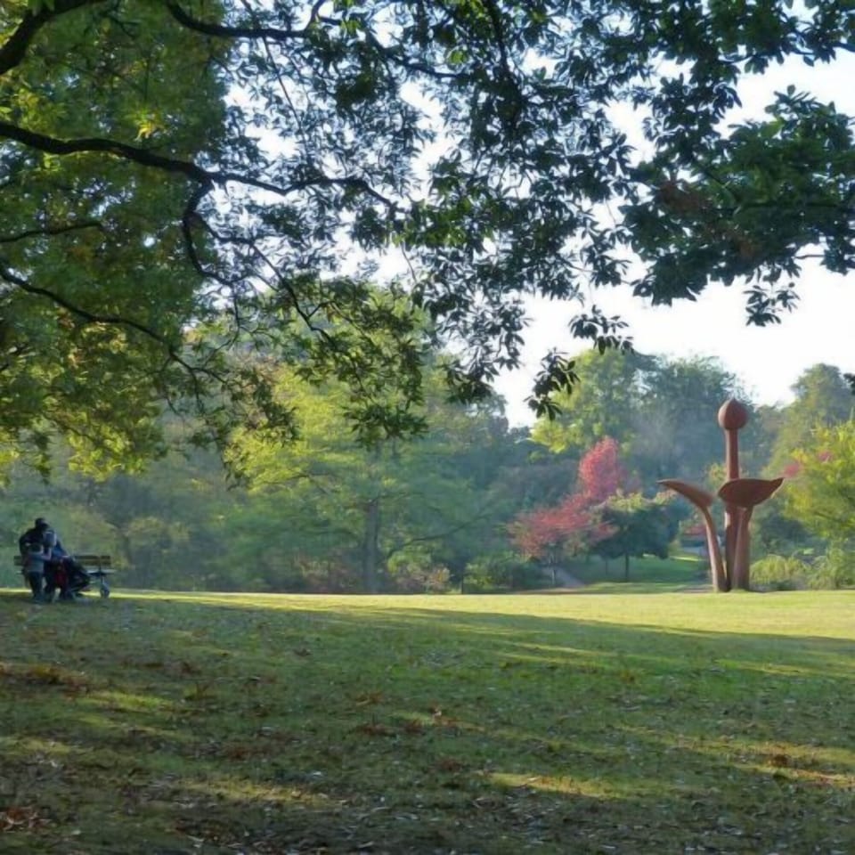 Wander shady pathways and relax on peaceful green lawns.