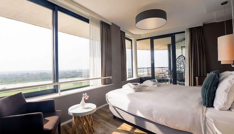 Stretch out in a sunlit corner room with balcony views.
