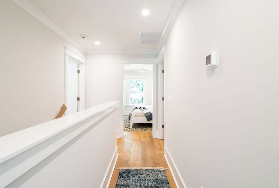 UPPER HALL TO THREE BEDROOMS AND TWO BATHS