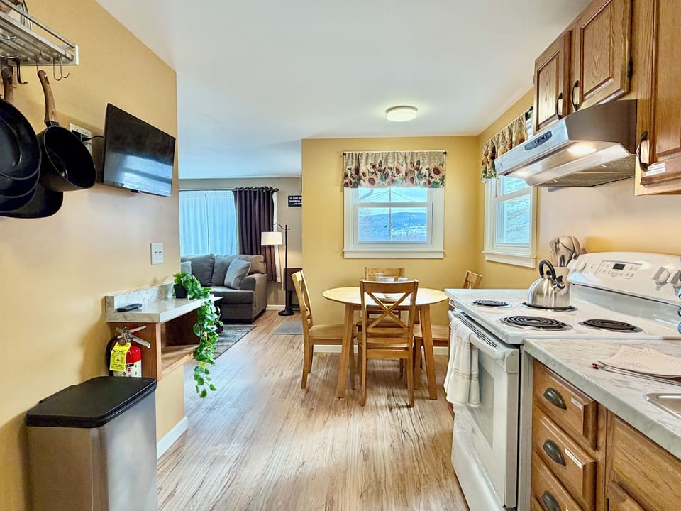 Prepare meals in the fully equipped kitchen and enjoy them at the cozy dining table. Perfect for family breakfasts, casual dinners, or morning coffee together.