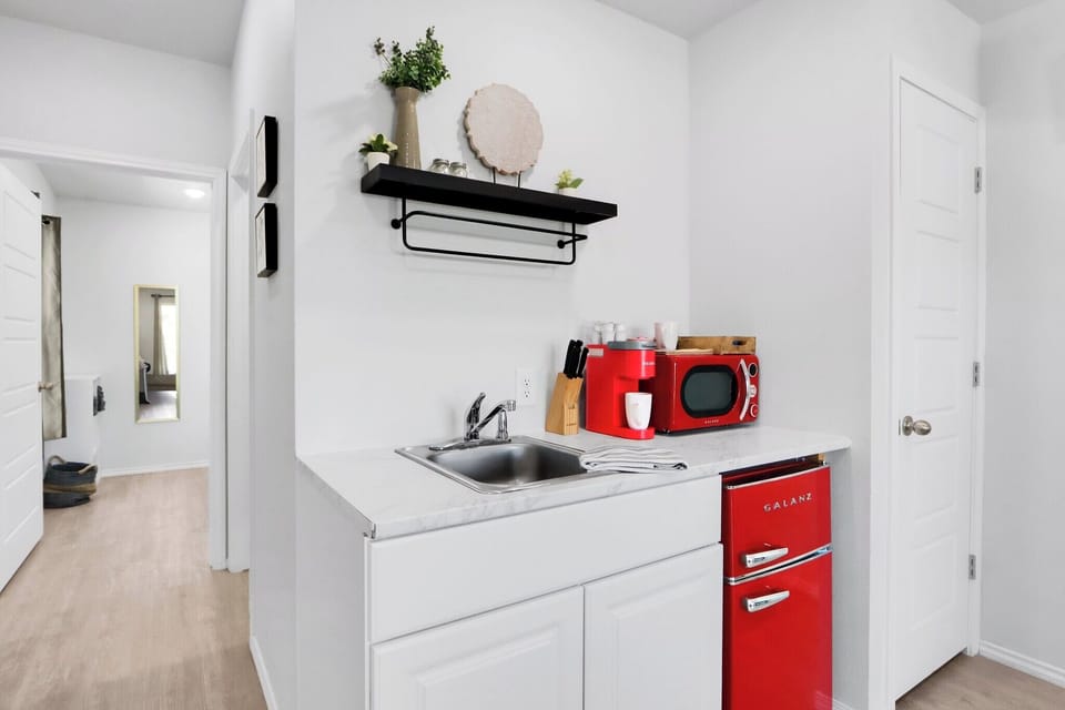 Kitchenette features a mini fridge and microwave - 1A