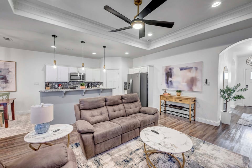 Open layout connecting kitchen, dining and living spaces.