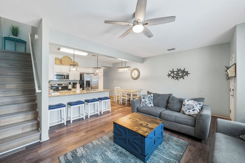 Relax in your spacious living area with cozy seating and an open kitchen perfect for gathering with loved ones.