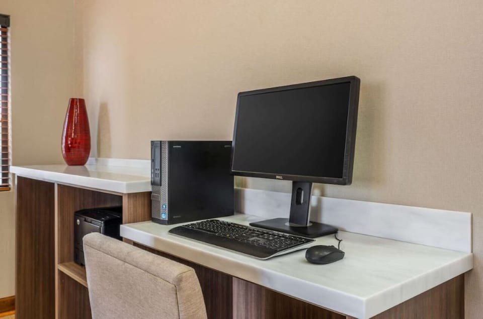 Catch up on emails at a quiet, convenient in-room workstation.