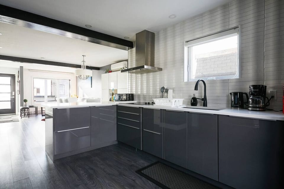 Clean and modern kitchen with ample counter space.
