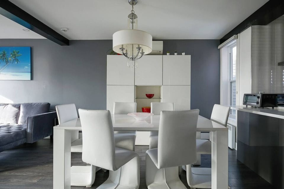 Dining table with seating for six, perfect for meals or a comfortable workstation.