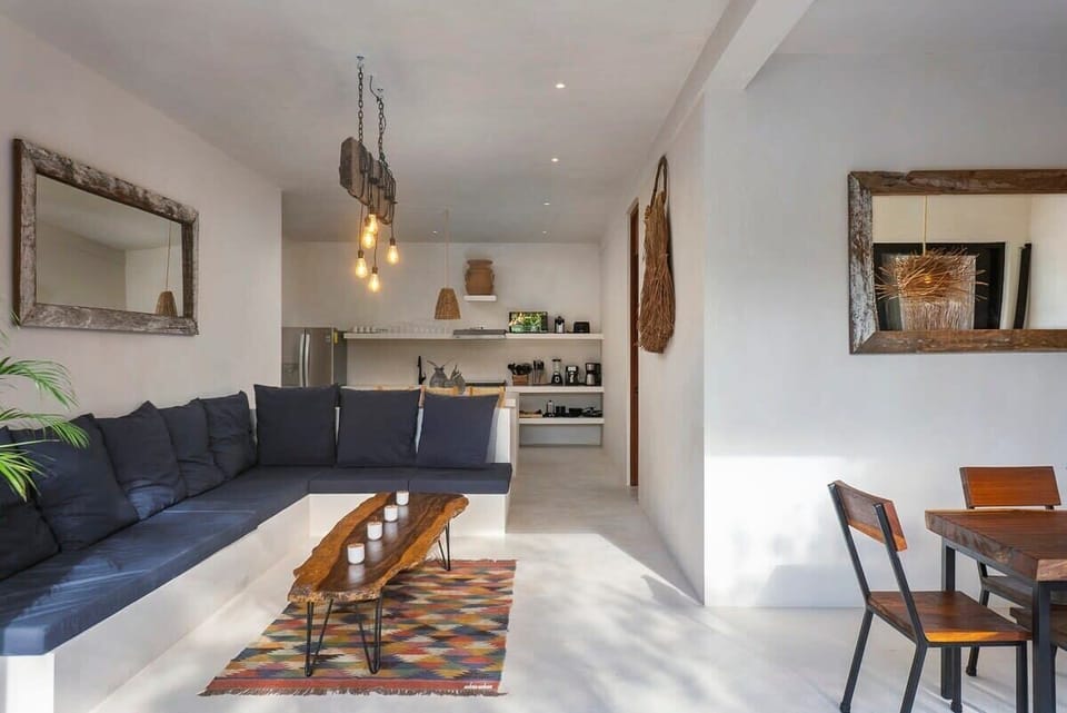 Ground floor designed with an open concept. Living room with a comfortable L-shaped sofa.
