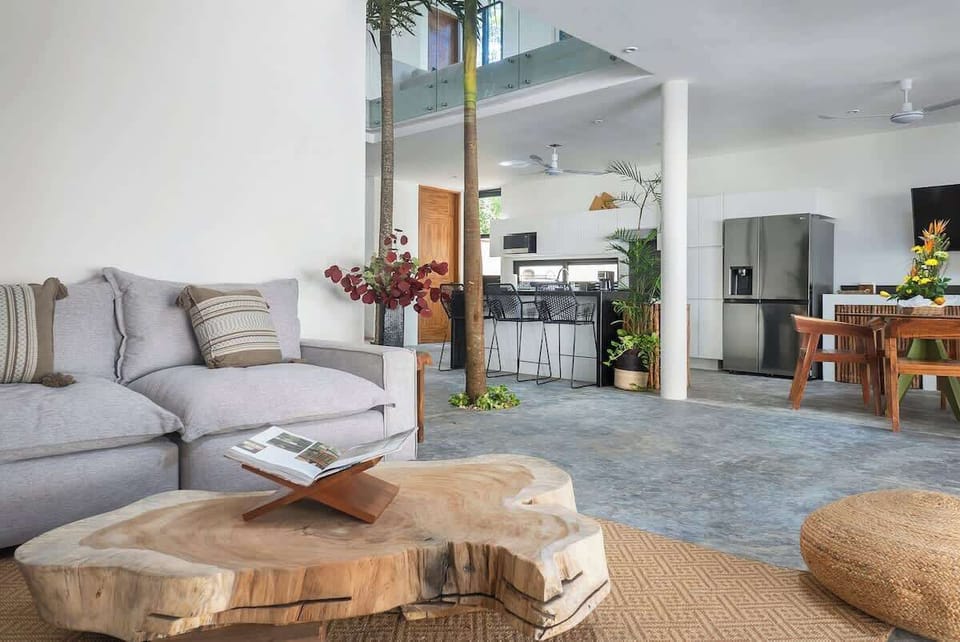 Elegant living room located on the ground floor. It shares space with the dining area and kitchen.
