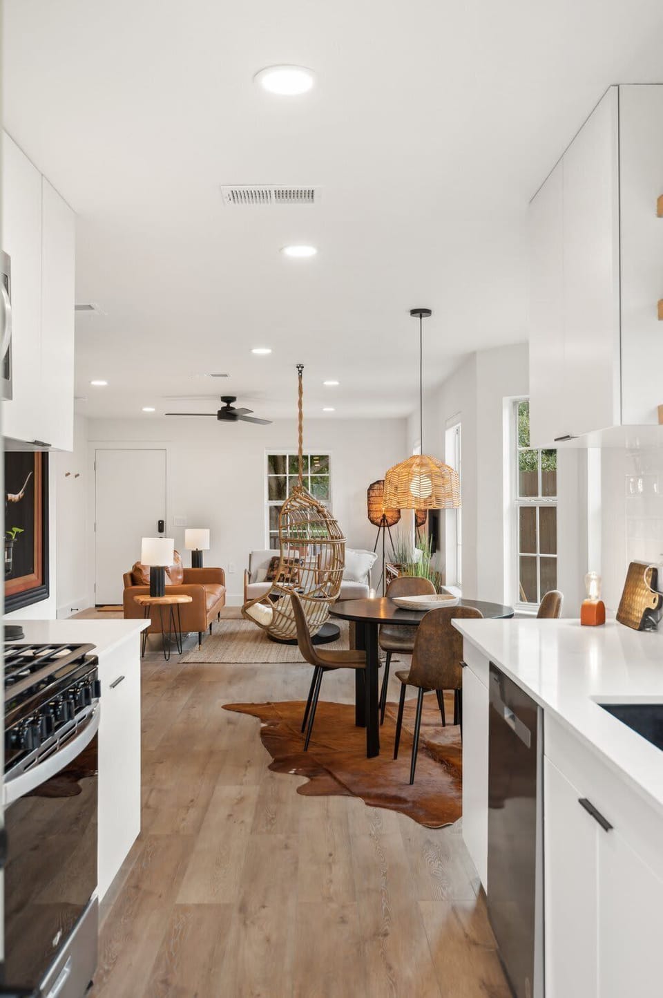 Open concept living and dining area designed for gathering and relaxing together.