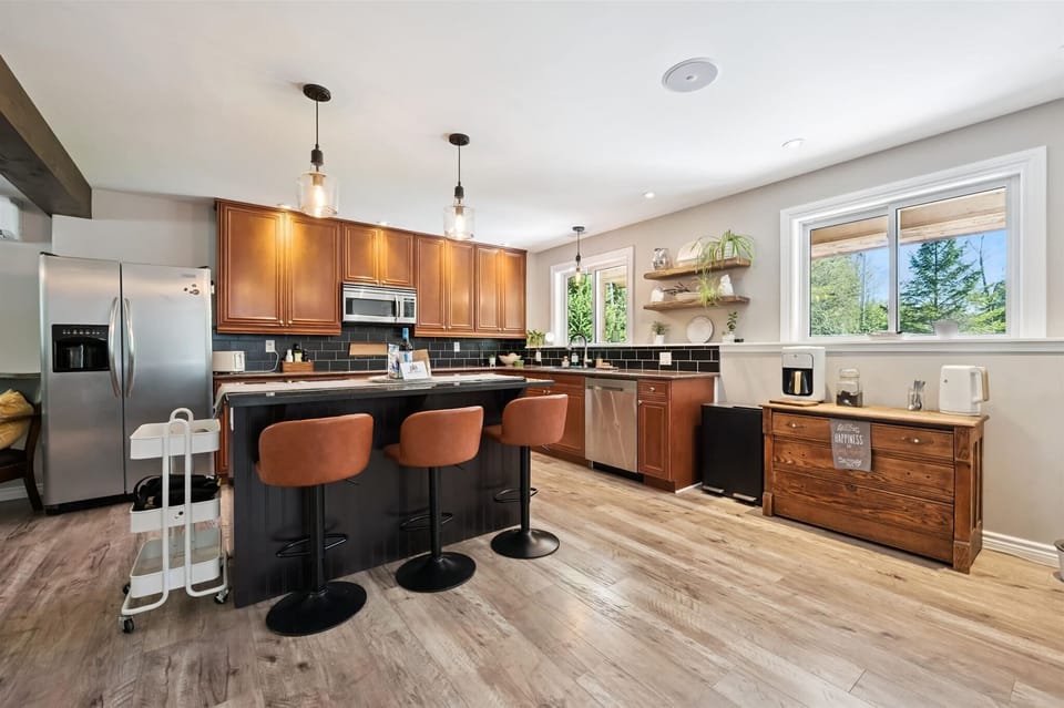 Spacious kitchen island with comfortable bar seating — perfect for casual meals, morning coffee, or gathering while cooking.