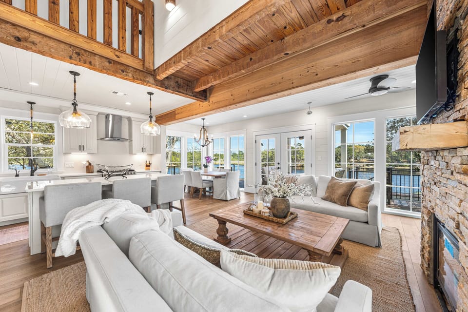 Enjoy the seamless flow between the airy living space, modern kitchen, and sun-drenched dining area