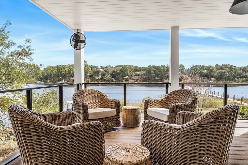 Picture yourself here: wine in hand, book open, and a perfect lake view