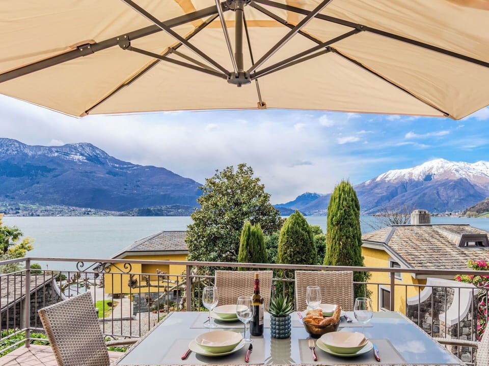 Furniture, Chair, Table, Outdoor Furniture, Outdoor Table, Umbrella, Shade, Kitchen & Dining Room Table, Mountain Range, Flowerpot