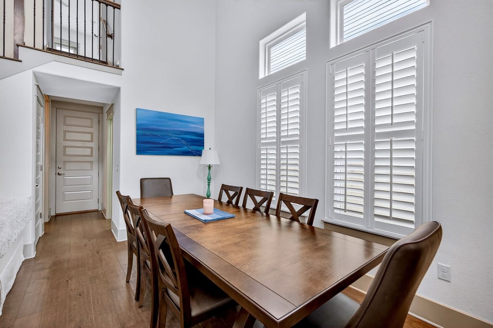 1st Floor - Spacious dining area with seating for 8 plus additional seating at the kitchen island, perfect for family meals and group gatherings. Open layout connects to the living room and chef’s kitchen.
