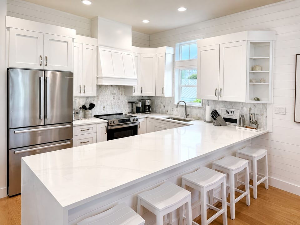 Bright modern kitchen with oversized island seating for four