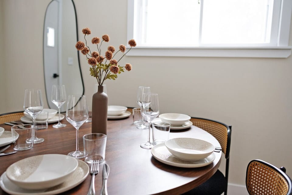 Dining Area: Elegant table set for delightful meals, featuring modern decor and natural light.