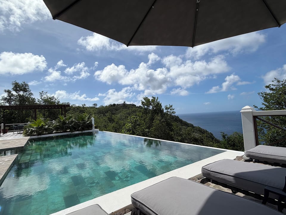 Float above Bequia’s quiet hills with panoramic ocean and mainland views