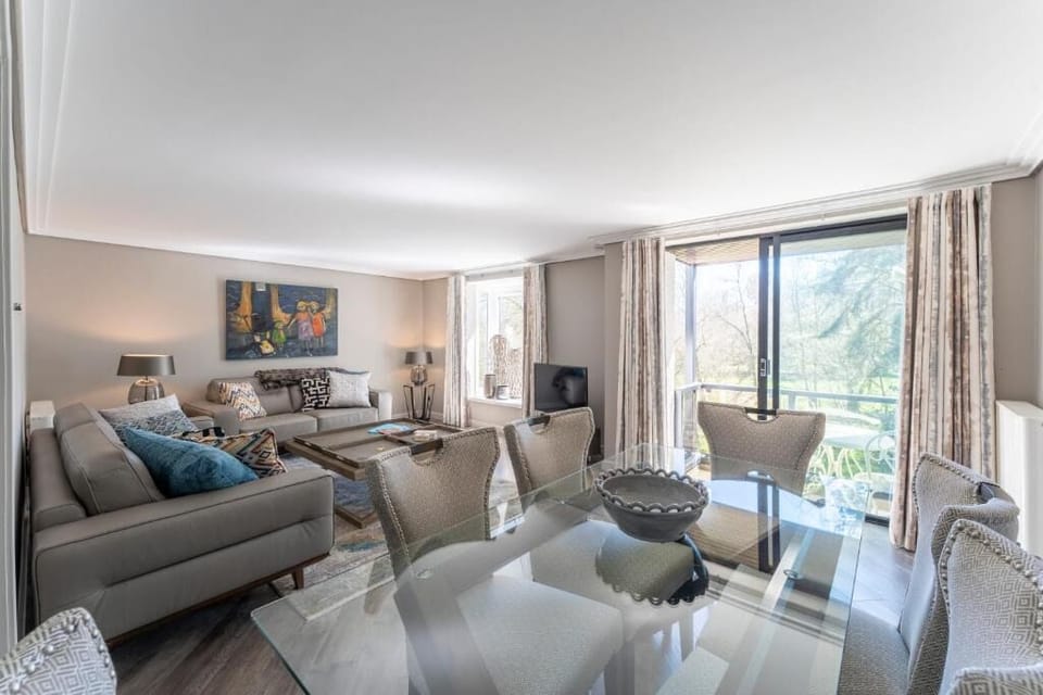 Unwind in sunlit open-plan lounge with calming balcony views.