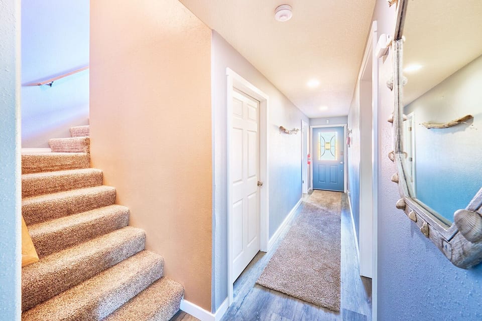The lower level features a game room, a TV sitting area, and laundry facilities