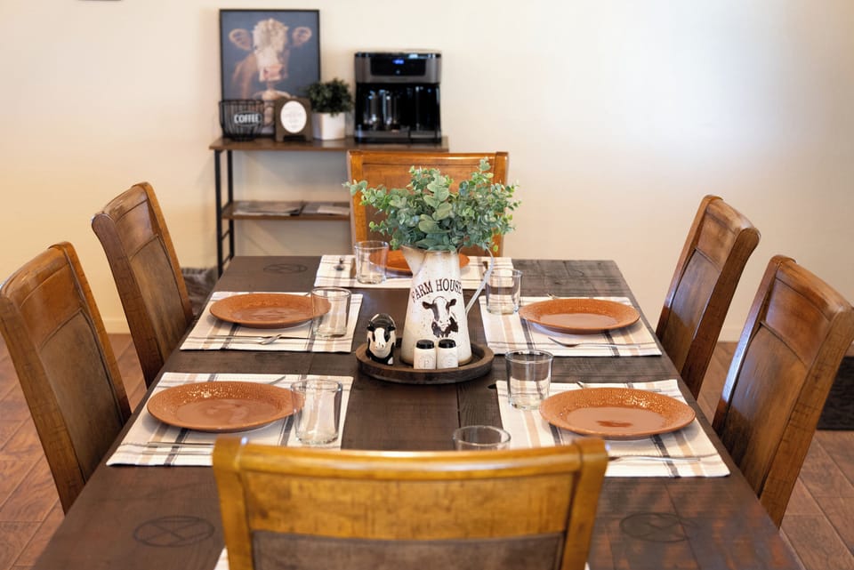 Dining table for six with a coffee station nearby