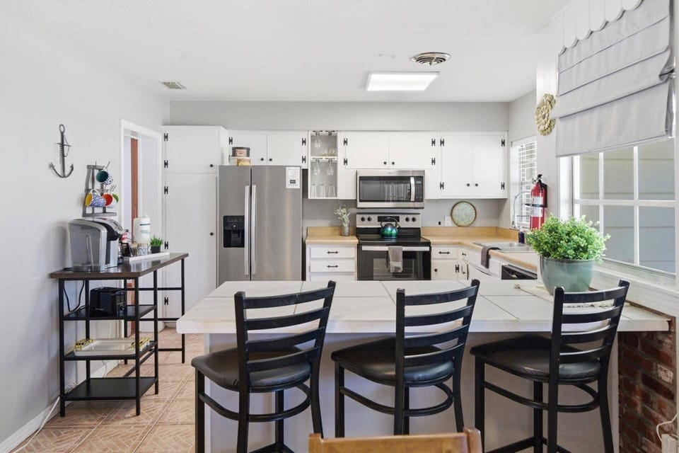 Breakfast bar seating for three makes mornings easy and casual.