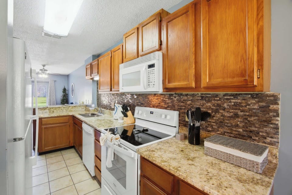 Discover culinary delights in this beautifully updated kitchen with granite countertops!