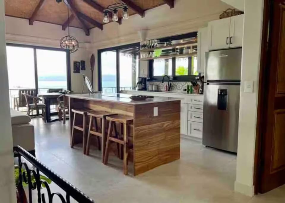New teak kitchen (2023) with induction cooktop.