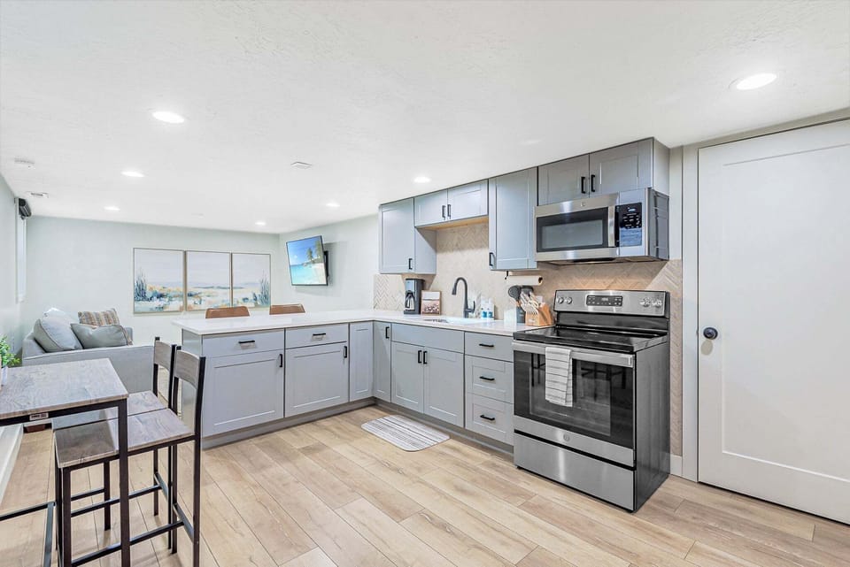 Open layout, recessed lighting, and modern finishes throughout. The whole space in one shot.