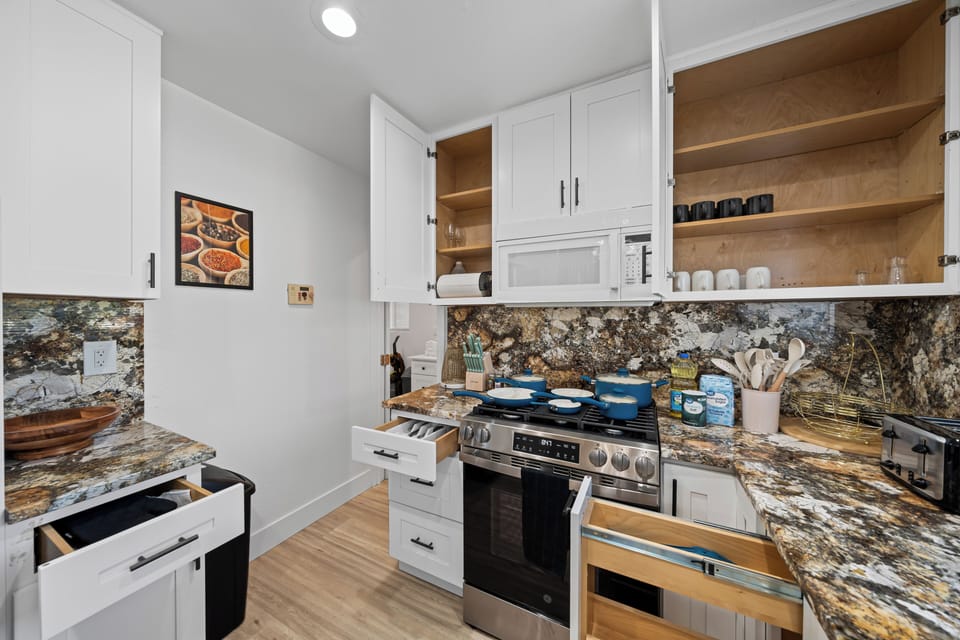Kitchen equipped with pans — ready for all your cooking needs.