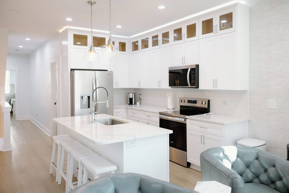 Open kitchen and dining layout provides ample space for entertaining, casual breakfasts, and family dinners.
