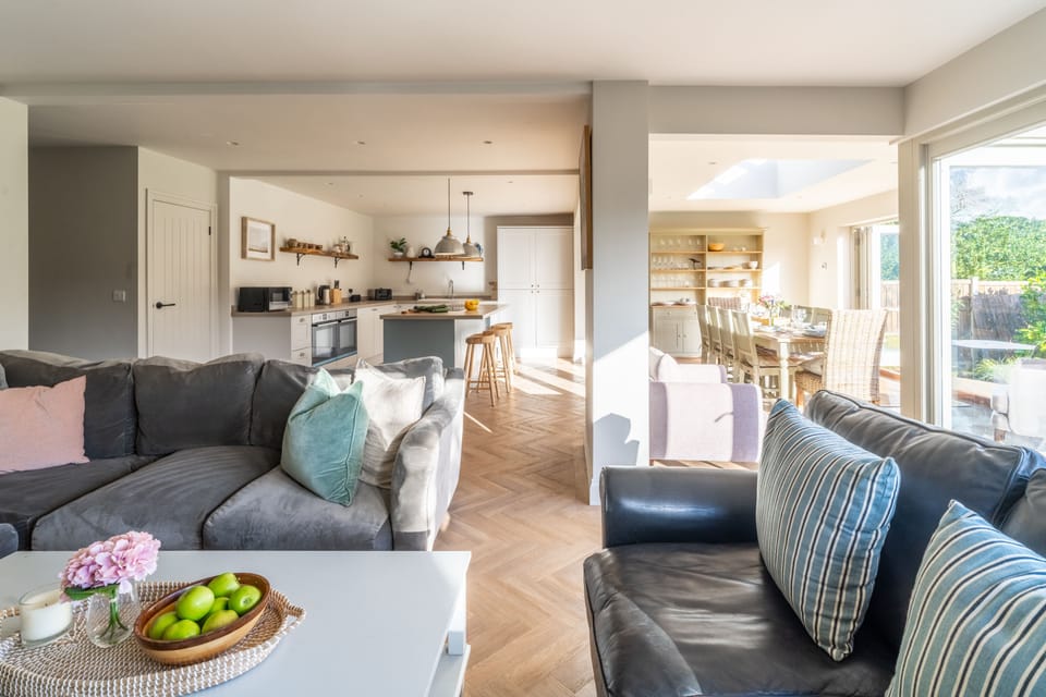Ground floor: Seating area with ample comfortable seating and french doors to the garden
