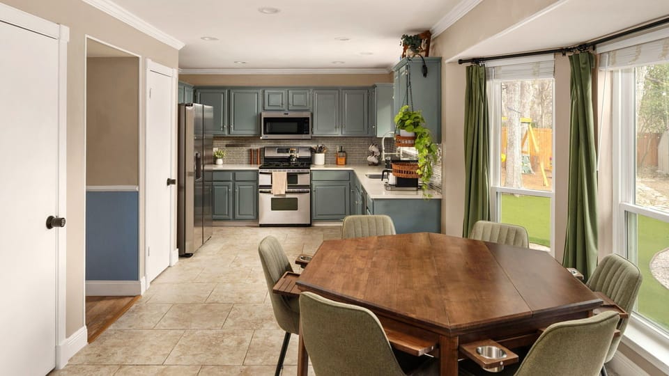 Bright and spacious kitchen with dining area — perfect for preparing meals and gathering with friends and family.